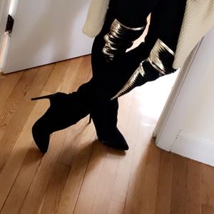 Black and gold knee high boots